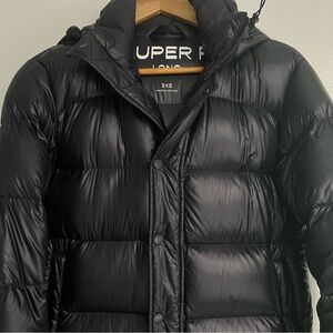 Aritzia The Super Puff Long In Hi-Gloss Black